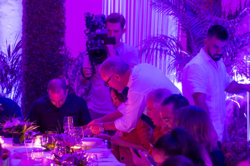 FIlm crew recording  while chef Michael Schwartz personally shaving truffel on the served soup