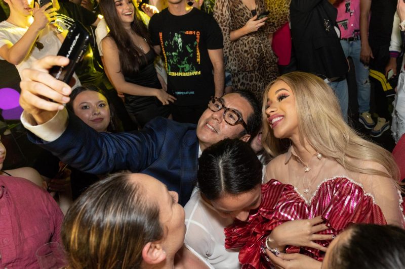 Cardi B taking selfies with fans